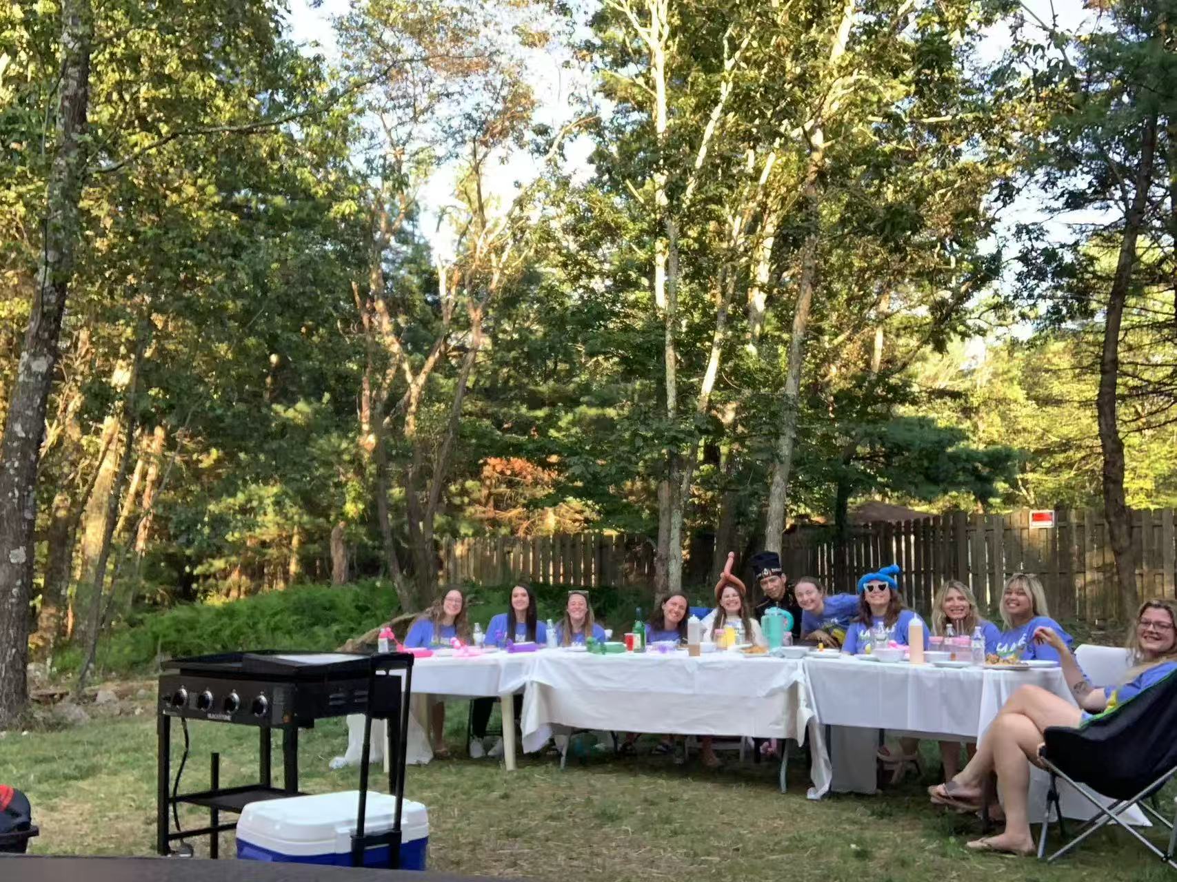 Guests enjoying a backyard hibachi party with private chef cooking in New York