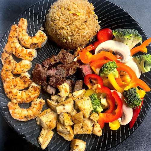 Triple protein hibachi plate with NY strip, chicken, and shrimp